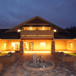 A well-lit building exterior at night.
