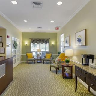 A well-lit lobby area with comfortable seating and decorative elements.