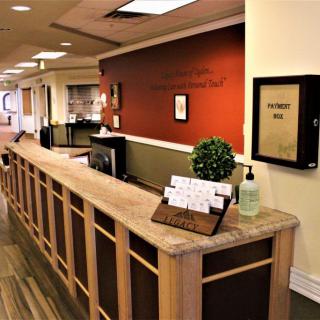 A reception desk in an office lobby with a welcoming atmosphere.