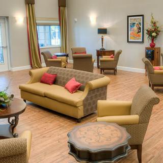 A cozy living room with comfortable seating and elegant decor.