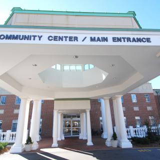 Main entrance of a community center with prominent columns.