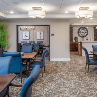 A modern lounge with comfortable seating and stylish lighting fixtures.