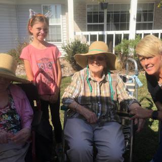 A joyful family gathering in the sun, enjoying each other's company.