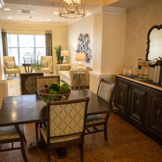 A beautifully designed living and dining area with elegant furnishings and soft lighting.