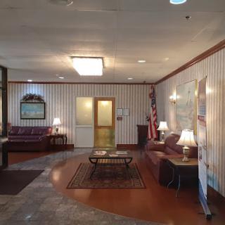 A cozy and welcoming lobby area with comfortable seating and warm lighting.