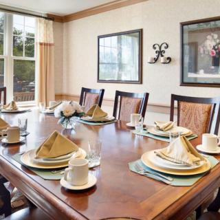 A beautifully set dining table in an elegant dining room.