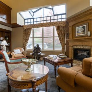 A luxurious living room with elegant furniture and a fireplace.