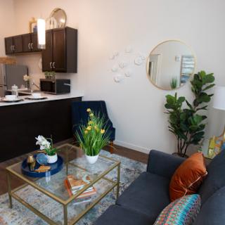 A stylish and modern living area featuring a cozy sofa, a chic coffee table, and elegant decorative elements.