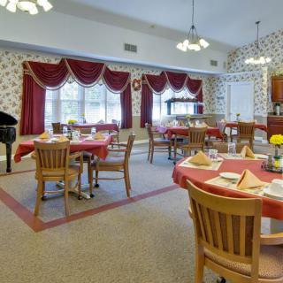 A cozy dining room with neatly arranged tables and elegant decor.