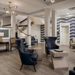 A modern and elegant hotel lobby with comfortable seating and stylish decor.