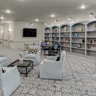A modern library with comfortable seating and well-organized bookshelves.