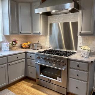 Modern kitchen with stainless steel appliances and sleek cabinetry.