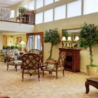 A spacious living room with elegant furniture and abundant natural light.
