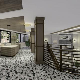 A modern interior space featuring a lounge area with open design and contemporary lighting.