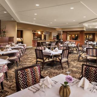 An elegant restaurant dining area with neatly set tables and stylish decor.