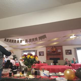 A festive gathering with vibrant decorations and a red-themed setup.