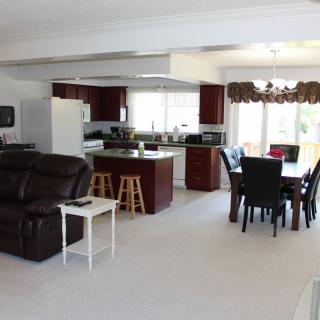 An open-concept living space with a kitchen and dining area.