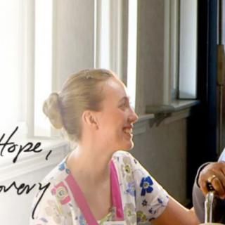 Two people engaging in a friendly conversation by the window.