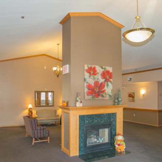 A cozy lobby area featuring a fireplace and comfortable seating.