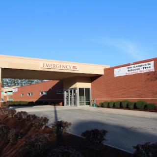An exterior view of a healthcare facility on a clear day.
