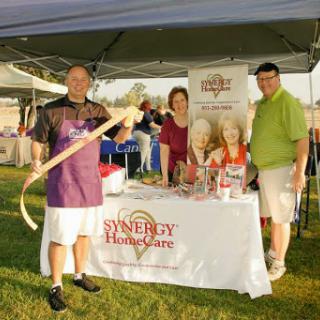 Representatives from Synergy HomeCare engaging with the community at a local event.