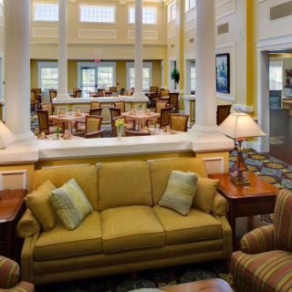 A spacious lounge area with comfortable seating and elegant decor.