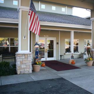 Entrance of a building with an American flag and decorative elements.