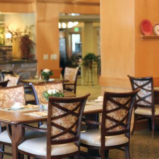 A cozy restaurant dining area with neatly arranged tables and chairs.