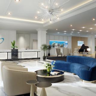 A contemporary lobby featuring stylish seating, elegant lighting, and modern decor.
