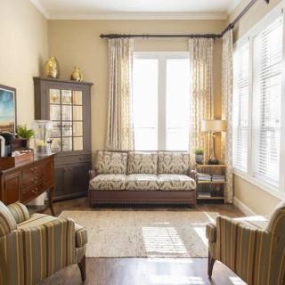 A cozy living room with stylish furniture and natural lighting.