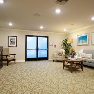 A cozy waiting room with comfortable seating and tasteful decor.