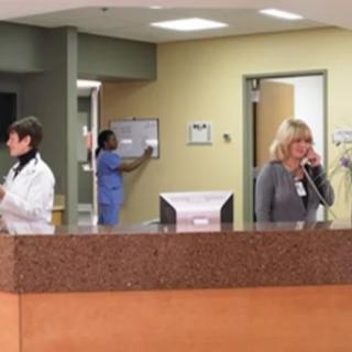 Hospital reception area with medical staff at work.