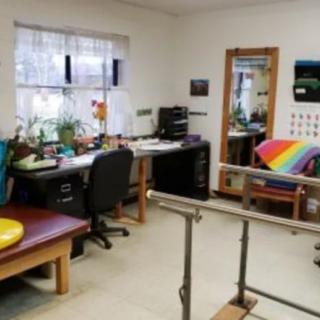 A rehabilitation clinic featuring equipment for physical therapy exercises.