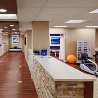 A modern office reception area with fitness equipment and a welcoming design.