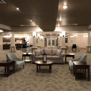 Spacious lobby area with arranged seating and elegant lighting.