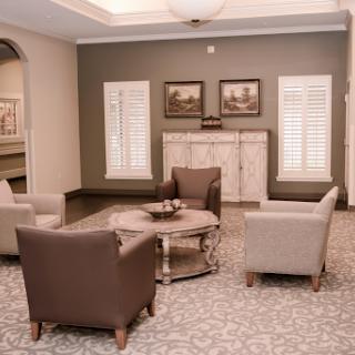 A cozy and elegantly styled living room featuring comfortable seating arrangements and tasteful decor.