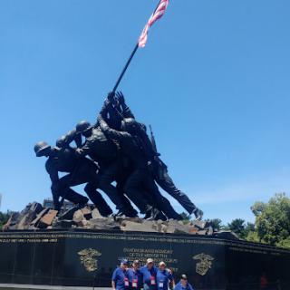 Visitors gathered at the iconic Iwo Jima Memorial, celebrating military history.