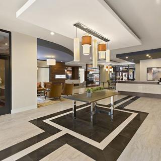 A spacious, modern lobby with sleek furniture and contemporary decor.