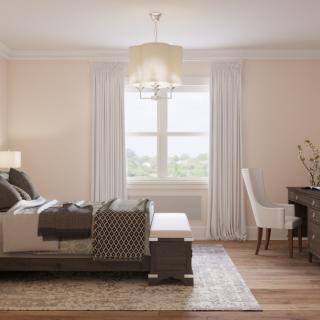 A serene bedroom interior with elegant furnishings and natural light.