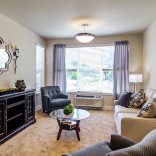 A cozy living room with comfortable seating and natural light.