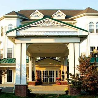 Front entrance of a large building with classical architectural elements.