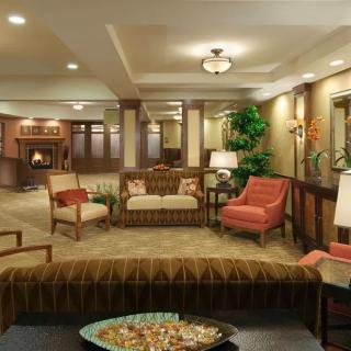 A cozy lobby area with comfortable seating and elegant decor.