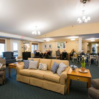 A cozy living room with comfortable seating and warm lighting.