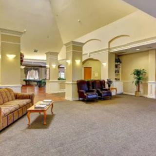 A spacious lobby area with comfortable seating and elegant decor.