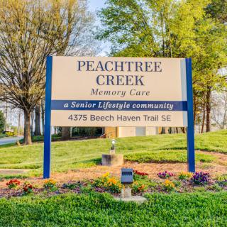 Sign for Peachtree Creek Memory Care, a senior lifestyle community.