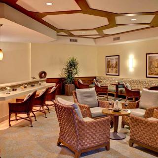 A cozy lounge area with comfortable seating and warm lighting.