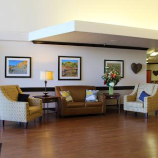 A welcoming lobby area featuring comfortable seating and decorative artwork.