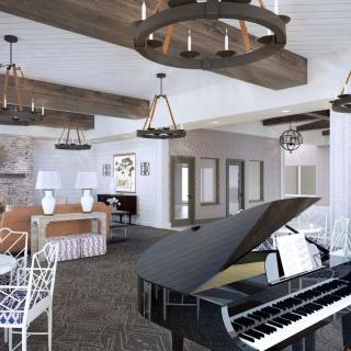 A beautifully designed living room featuring a grand piano and elegant chandeliers.
