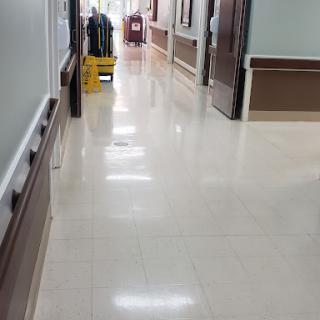 A clean, well-maintained hallway in a hospital setting.