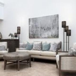 A modern living room with neutral tones and stylish decor.